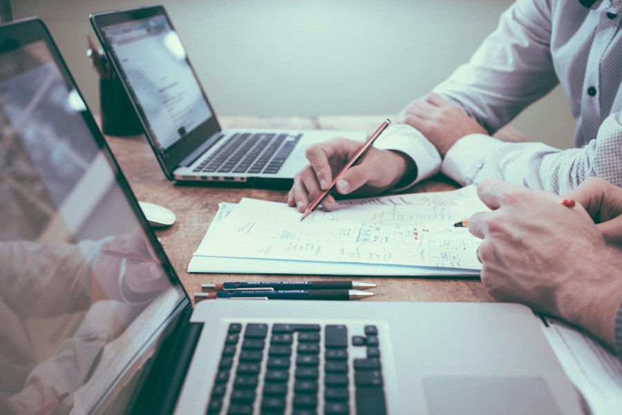Business documents and planning notes illustrating a buying brief