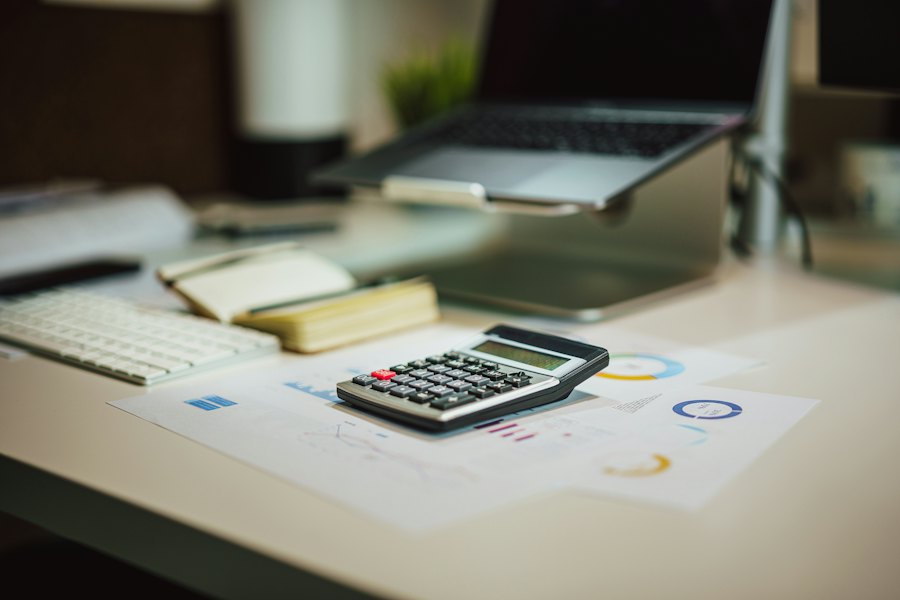 Illustrative business financial paperwork and calculator
